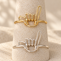 Shaka Wire Ring in gold-filled and sterling silver, shown together to compare material options; sold individually.