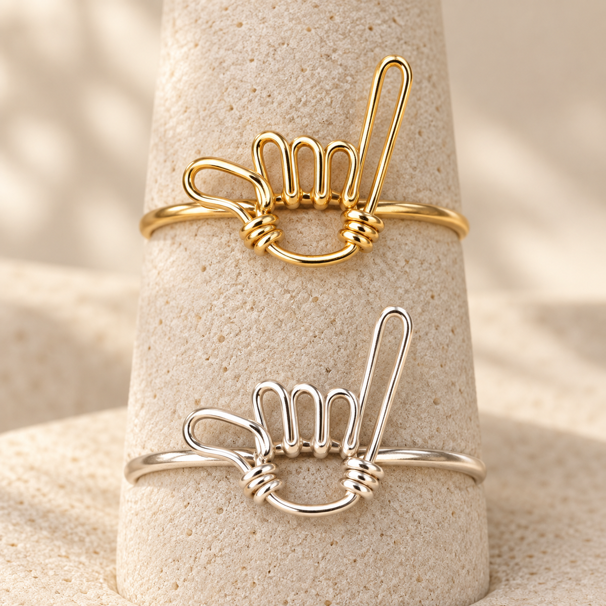 Shaka Wire Ring in gold-filled and sterling silver, shown together to compare material options; sold individually.